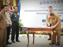 Bupati Tamba Tandatangani NPHD Pengamanan Pilkada 2024