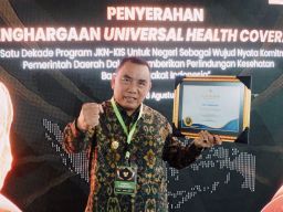 Kado Manis Hut Kota Negara ke- 129, Jembrana Raih Penghargaan UHC Kategori Utama