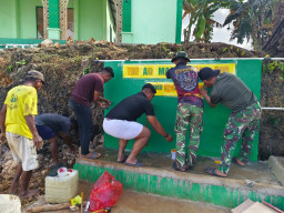 Stiker Program Manunggal Air Bersih Dipasang pada Bak Penampungan Air TMMD ke-129